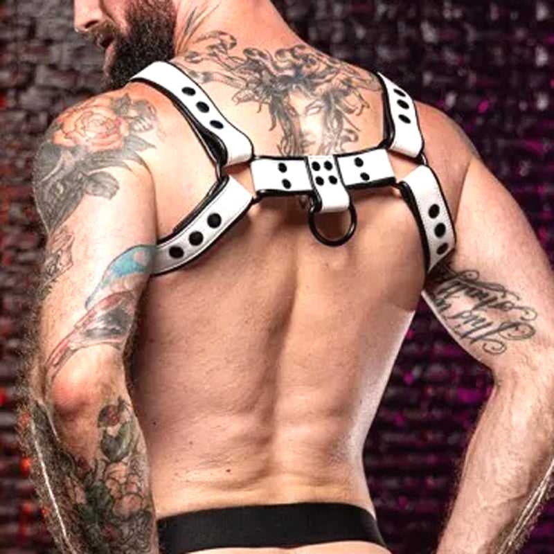Back view of a tattooed man wearing a white thickened and black contrasting men's harness, emphasizing bold fashion accessory