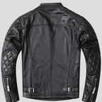 Black quilted leather motorcycle jacket with textured quilted panels on sleeves, zippered cuffs, and adjustable waist buckles, designed for biker style.