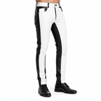 Back view of men's white and black leather pants with contrasting panel design, fitted silhouette, and black leather shoes