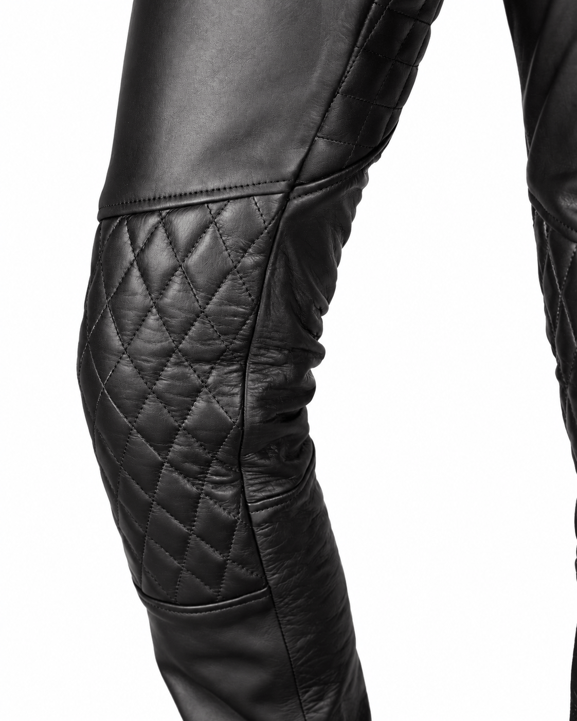 Black leather pants with quilted detailing on thighs and knees, showing a high waist with a belt and zipper fly, styled for biker gear.