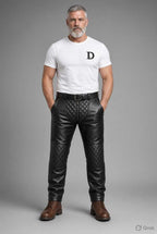 Men's padded thru zip black leather pants with quilted knee panels, front zipper, and belt loops, styled with brown boots, ideal for biker fashion.